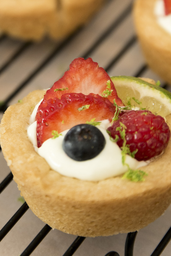 Key lime pie cookie cups are irresistible dessert with tangy limes mixed with creamy filling. It's so delicious when the key lime pie is stuffed in chewy sugar cookie cups. It's so easy to make and comes together in no time!