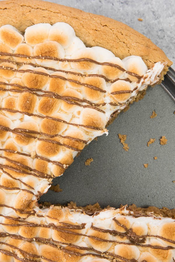 S’mores Pie is gooey, chocolatey, rich and crunchy! Graham cracker crust, toasted marshmallow and rich chocolate are baked into a delicious smores pie. It’s so much better than standing around a campfire