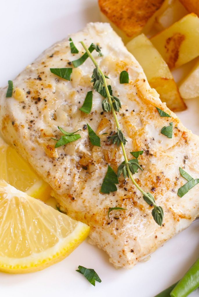 Sous Vide Halibut – tender and buttery halibut that’s full of delicious garlic butter flavor! The sous vide method cooks it to the precise temperature you set, and then finish with a quick searing to get the halibut beautifully browned!