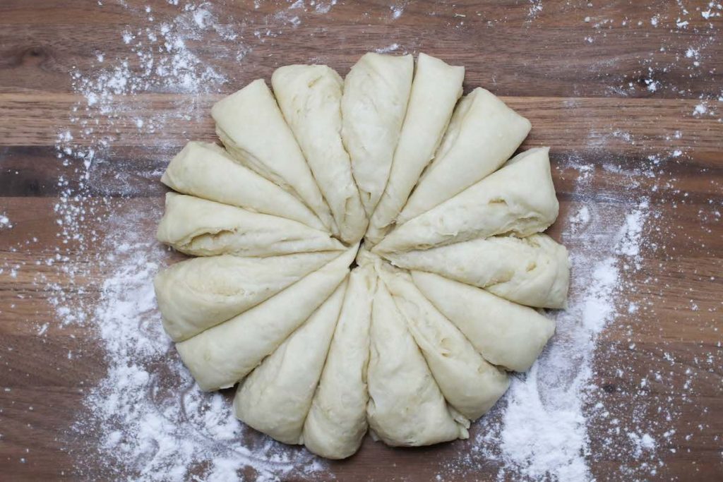 Dividing the dough into 16 equal portions.