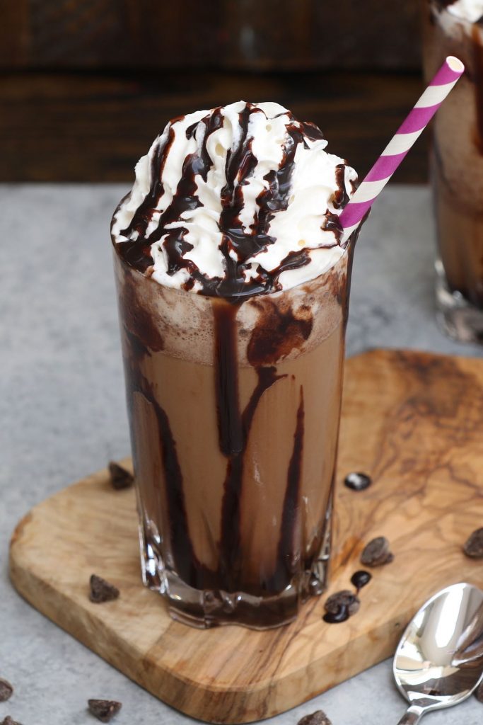 This copycat recipe for Starbucks’ Java Chip Frappuccino is the real deal! It gives you all the delicious flavor of the store-bought drink at the fraction of the price. Smooth, creamy, and full of chocolate and coffee flavor, this homemade Frappuccino takes less than 5 minutes with a few simple ingredients. #JavaChipFrappuccino #StarbucksFrappuccino #FrappuccinoRecipe