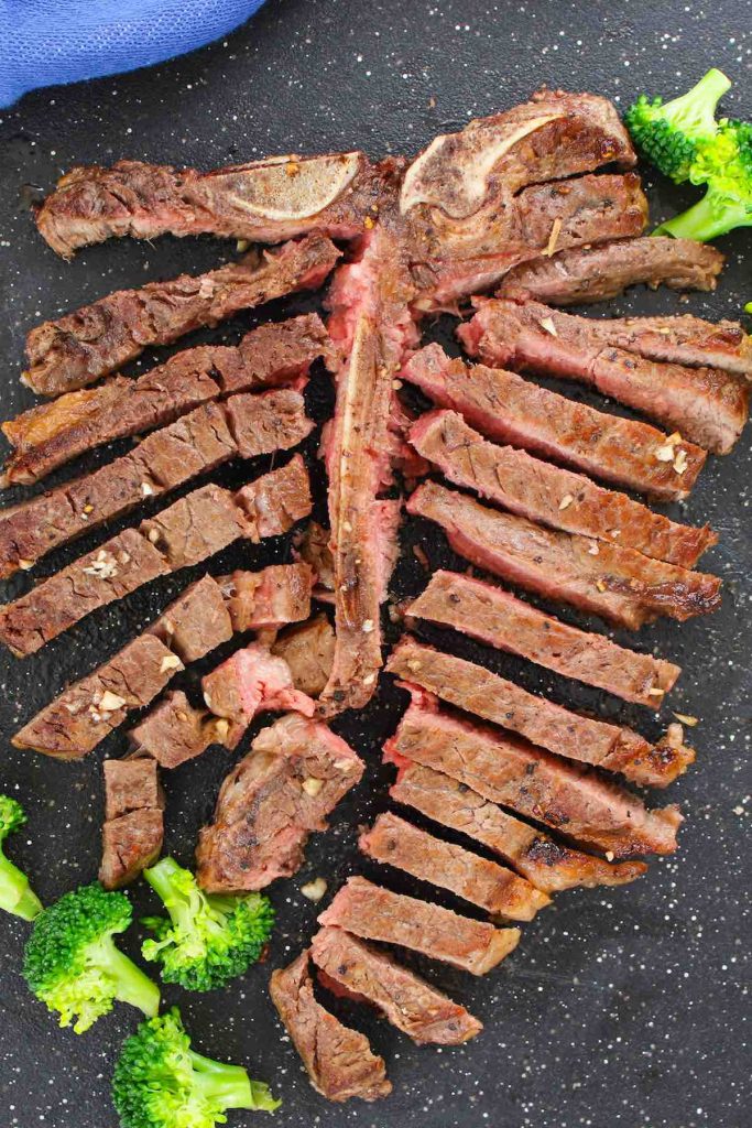 Sous vide porterhouse steak cut into thin slices.