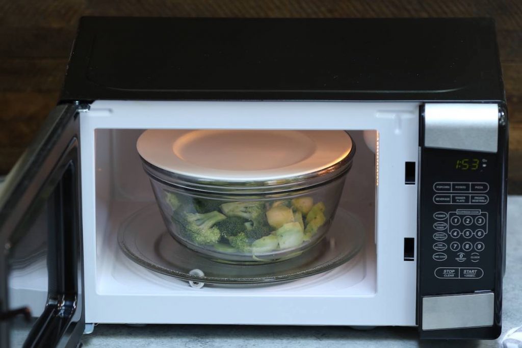Cover the bowl with a ceramic plate, and place it in the microwave.