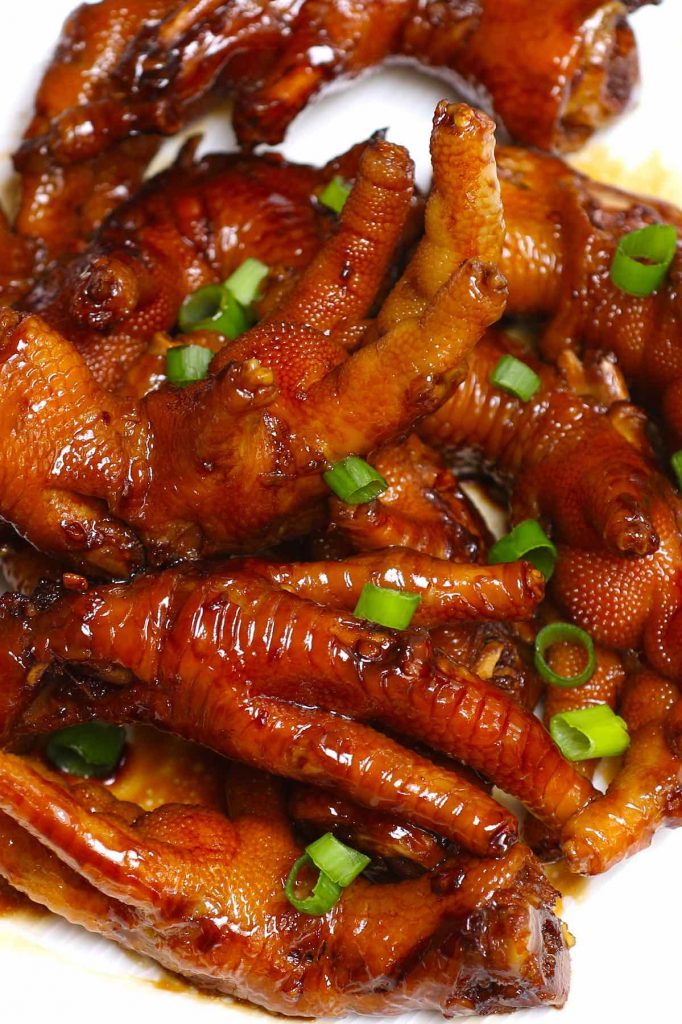 These braised Chicken Feet are cooked long and slow in a rich sauce – so tender and flavorful! This healthy recipe rivals what you would find in the best Chinese Dim Sum restaurant. The best part? No deep-frying required! #ChickenFeet #ChickenFeetRecipe #ChickenFeetDimSum
