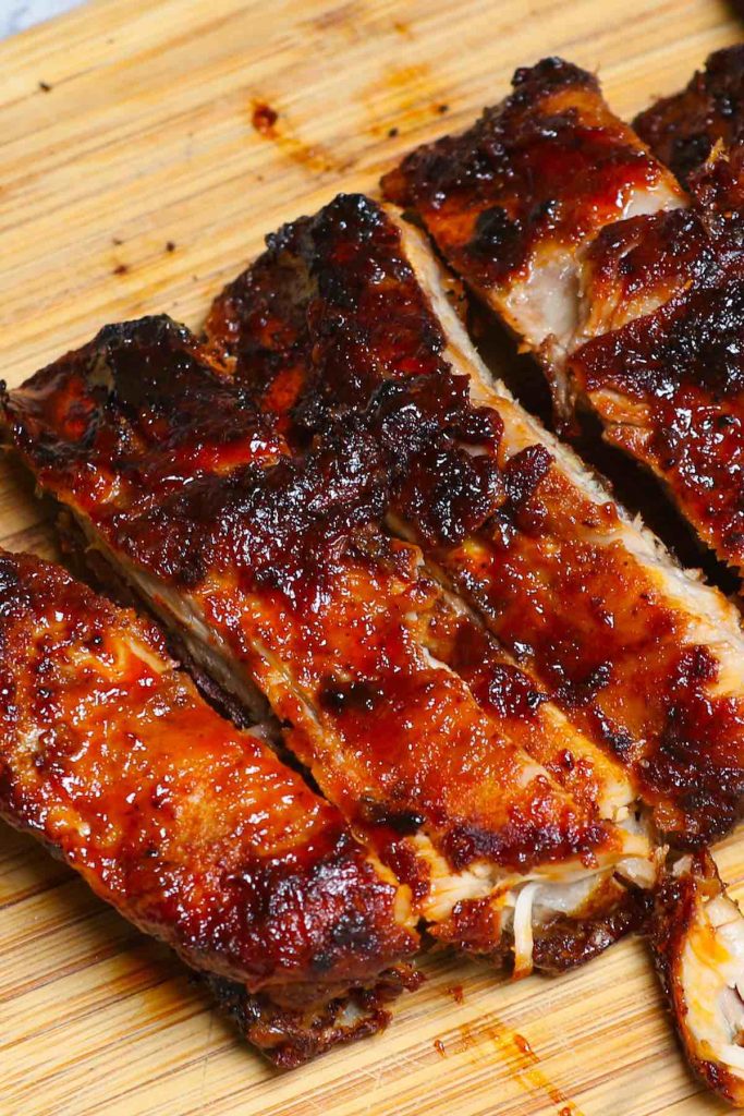 These are the best Air Fryer Ribs – so tender, crispy, and flavorful but not fall-off-the-bone! It’s a super easy recipe that takes 30 minutes to make. Baby back ribs are seasoned with a simple dry rub, and then cooked in the air fryer, finally coated with a homemade sticky barbecue sauce. They are juicy, finger-licking delicious pork ribs and so addictive! #AirFryerRibs #AirFryerPorkRibs #AirFryerBabyBackRibs