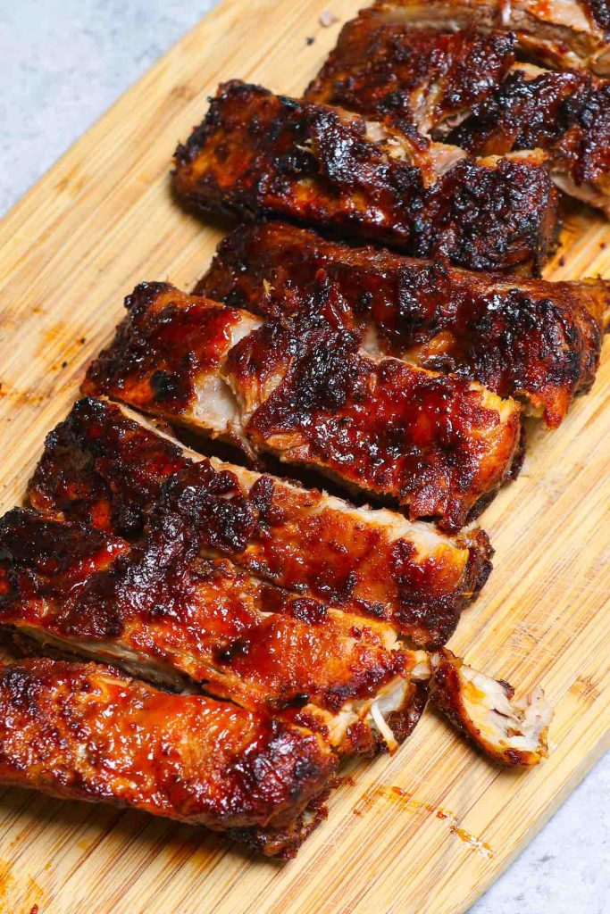These are the best Air Fryer Ribs – so tender, crispy, and flavorful but not fall-off-the-bone! It’s a super easy recipe that takes 30 minutes to make. Baby back ribs are seasoned with a simple dry rub, and then cooked in the air fryer, finally coated with a homemade sticky barbecue sauce. They are juicy, finger-licking delicious pork ribs and so addictive! #AirFryerRibs #AirFryerPorkRibs #AirFryerBabyBackRibs