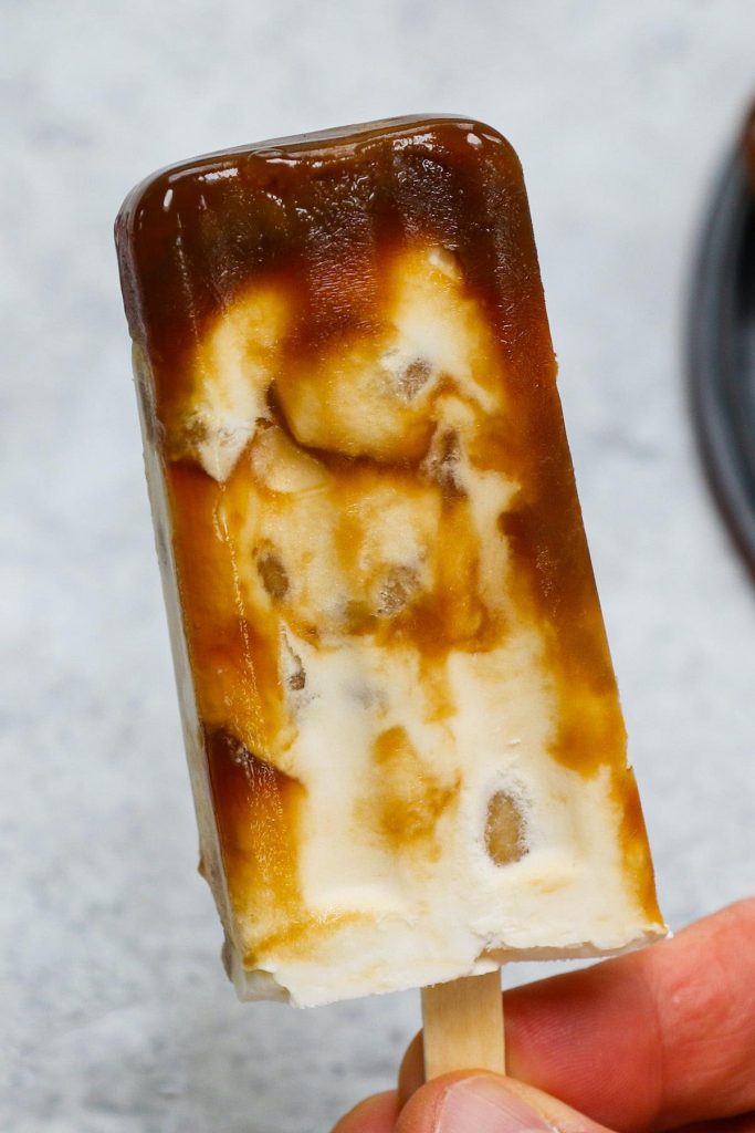 Ever tried Brown Sugar Boba Ice Cream Bars? This Asian frozen dessert has been a viral sensation around the world recently. It has a delicious combination of sweet, creamy ice cream and soft, chewy bubble tea pearls. Here is an easy recipe showing you how to make this special treat at home, rivaling the popular Shao Mei Boba popsicles. #BobaIceCream #BobaIceCreamBar #BrownSugarBobaIceCream