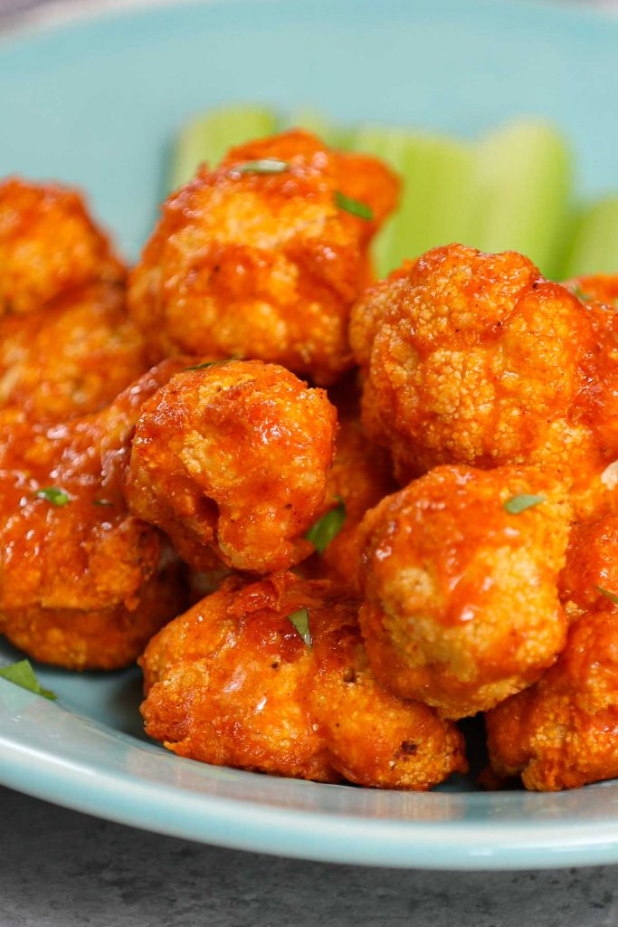 Air Fryer Buffalo Cauliflower is a healthy and low-carb appetizer, snack, or side dish made with NO OIL! These spicy vegan cauliflower bites don’t taste like Buffalo wings, but they’re definitely healthier with an even better flavor. This is a really easy recipe and takes less than 20 minutes in the air fryer.