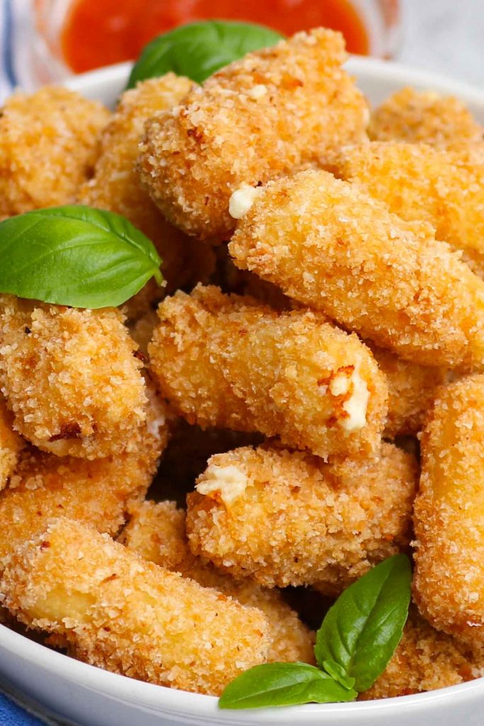 Olive Garden is known for its delectable Italian menu items, including appetizers. For those who want to go beyond breadsticks, this copycat Stuffed Ziti Fritta is crispy, cheesy and packed with flavors. Cooked rigatoni pasta is stuffed with a delicious cheese mixture and then fried to golden perfection!