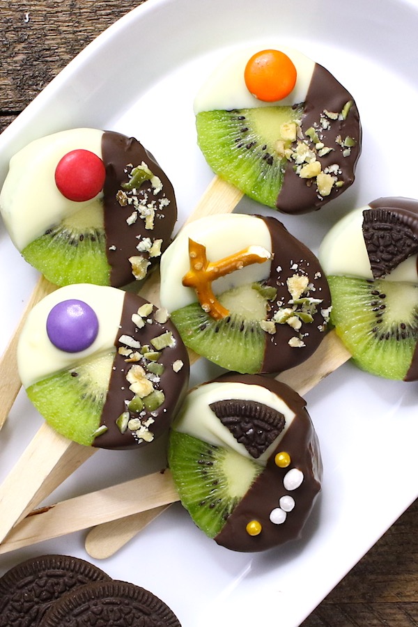 These Chocolate Dipped Kiwi Pops are beautiful and irresistibly delicious, with yummy chocolate and fresh kiwi fruit in every single bite.