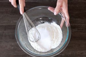 In a medium-large bowl, add flour, baking powder, salt, and sugar.