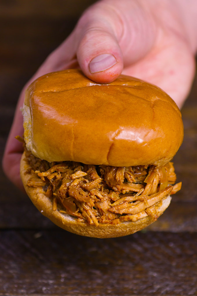 pulled pork sandwich made with the shredded pork shoulder crock pot