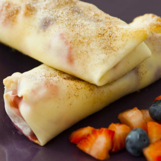 Cheesecake Egg Rolls are filled with cream cheese and mixed berries, all wrapped in soft egg rolls and baked to crispy perfection. The perfect make-ahead appetizer or dessert for any event!