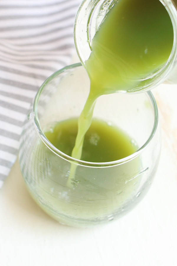 Closeup of pouring celery juice to show the thin texture.
