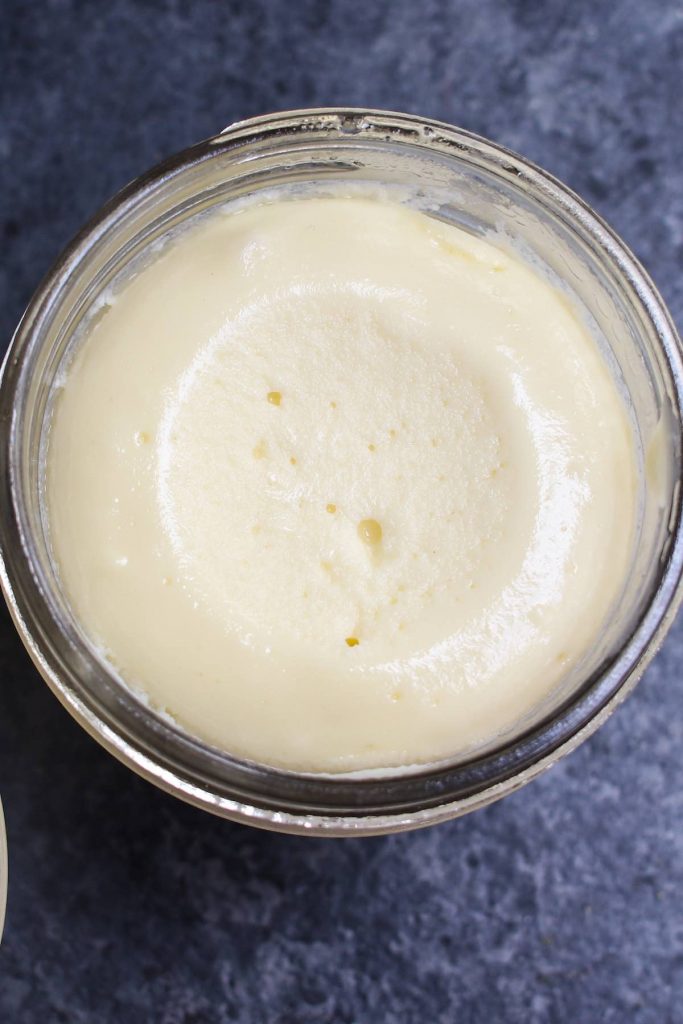 Closeup of the smooth and creamy texture of the sous vide cheesecake in a jar.