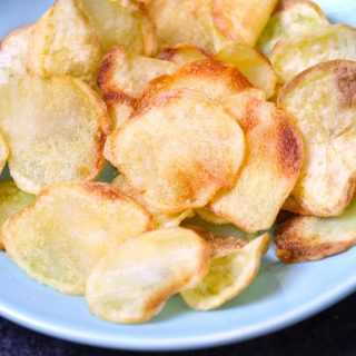 Crispy and healthy homemade Air Fryer Potato Chips made with only 3 ingredients. No oil needed! Season them up the way you like. This crunchy snack tastes so good and you’ll never buy store-bought potato chips again!