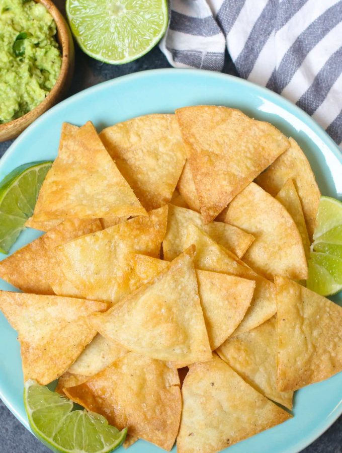 The best ever super crispy and crunchy Air Fryer Tortilla Chips without oil! You’ll only need 3 ingredients and a few minutes! #AirFryerTortillaChips