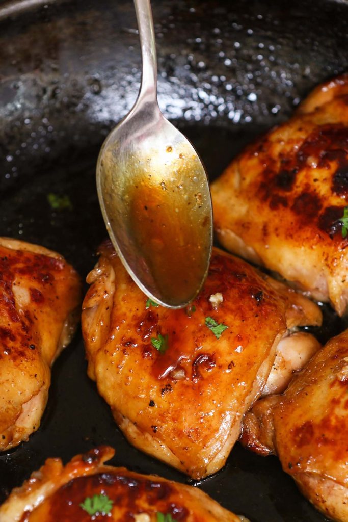 Honey Garlic Sous Vide Chicken Thighs are super juicy, tender and full of flavor. Sous vide method cooks these chicken thighs to the perfect doneness, and then a quick sear produces the amazing crispy skin on the outside. With tips on how to cook from fresh or frozen. #SousVideChickenThighs #SousVideChicken