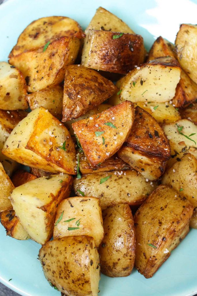 Garlic Herb Sous Vide Potatoes are so creamy, fluffy, and loaded with flavor. This simple and delicious side dish recipe takes a few minutes to prepare, then the sous vide machine will do the rest of the work and cook the potatoes to perfection! #SousVidePotatoes