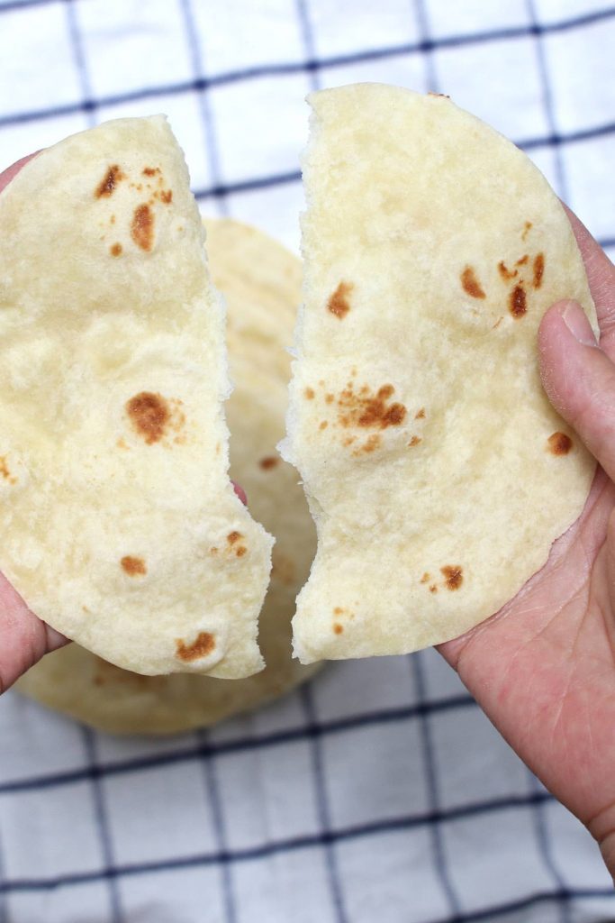These Homemade Vegan Flour Tortillas are so soft and fluffy – a delicious and healthy alternative to traditional Mexican tortillas. This recipe is easy to make with only 5 inexpensive, easy-to-get ingredients, and can be done completely by hand!
