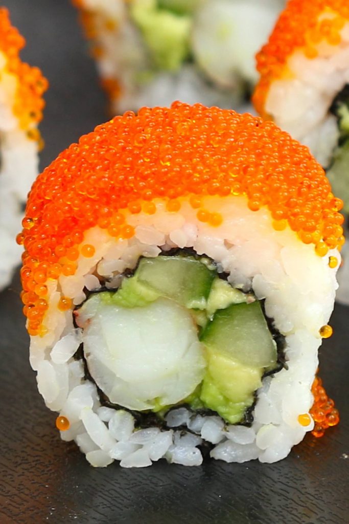 Boston Rolls are filled with creamy avocado, succulent shrimp, and crunchy cucumber, then rolled in nori seaweed sheet and sushi rice! It’s usually garnished with the bright orange tobiko (Japanese flying fish roe). In this recipe, you will learn how to make sushi rice, how to select fillings, how to roll the the sushi, and how to garnish with tobiko! #BostonRoll #BostonSushi #BostonRollSushi