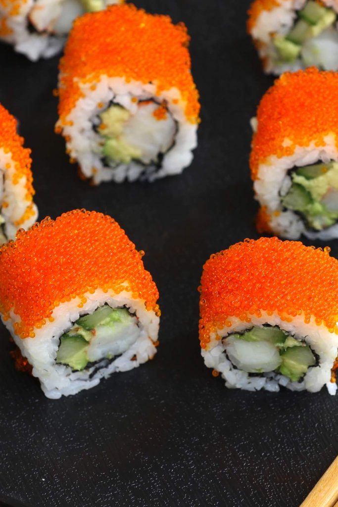 Sushi rolls topped with tobiko.