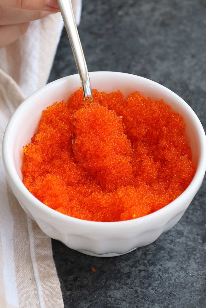 Tobiko is the Japanese word for flying fish roe, which is crunchy and salty with a hint of smoke. It’s a popular ingredient in Japanese cuisine as a garnish to sushi rolls.