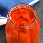 Yamagobo is Japanese pickled burdock root marinated in rice vinegar, sugar and salt mixture. It’s tangy, sweet, and refreshingly crunchy with a bright orange color. Homemade Yamagobo is incredibly easy to make, and great as an accompaniment to sushi rolls or rice meals.
