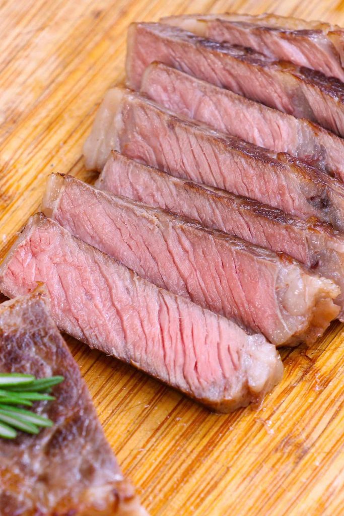 Sous Vide New York Strip Steak is my favorite steak recipe. All you need is a few very simple ingredients to bring out the best flavor of this popular cut.  The sous vide method cooks it perfectly edge to edge, producing a better-than-restaurant quality right at your own home! #SousVideNewYorkStrip #SousVideNYStrip #SousVideSteak