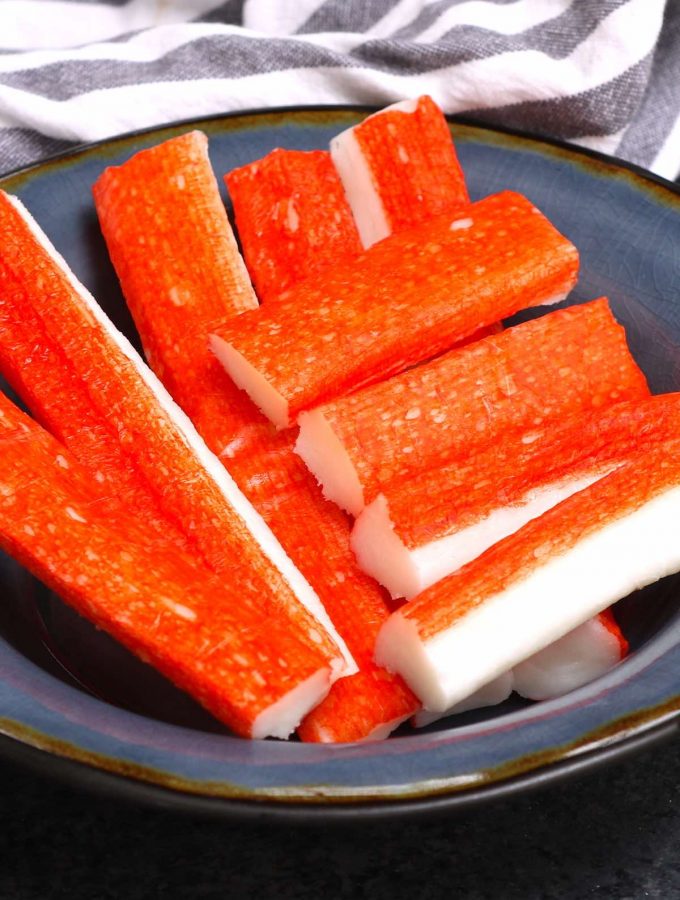 Kanikama is the Japanese name for imitation crab, which is processed fish meat, and sometimes called crab sticks or ocean sticks. It’s a popular ingredient commonly found in California Sushi Rolls, crab cakes, and crab rangoons. #Kanikama #ImitationCrab #ImitationCrabMeat #imitationCrabRecipes