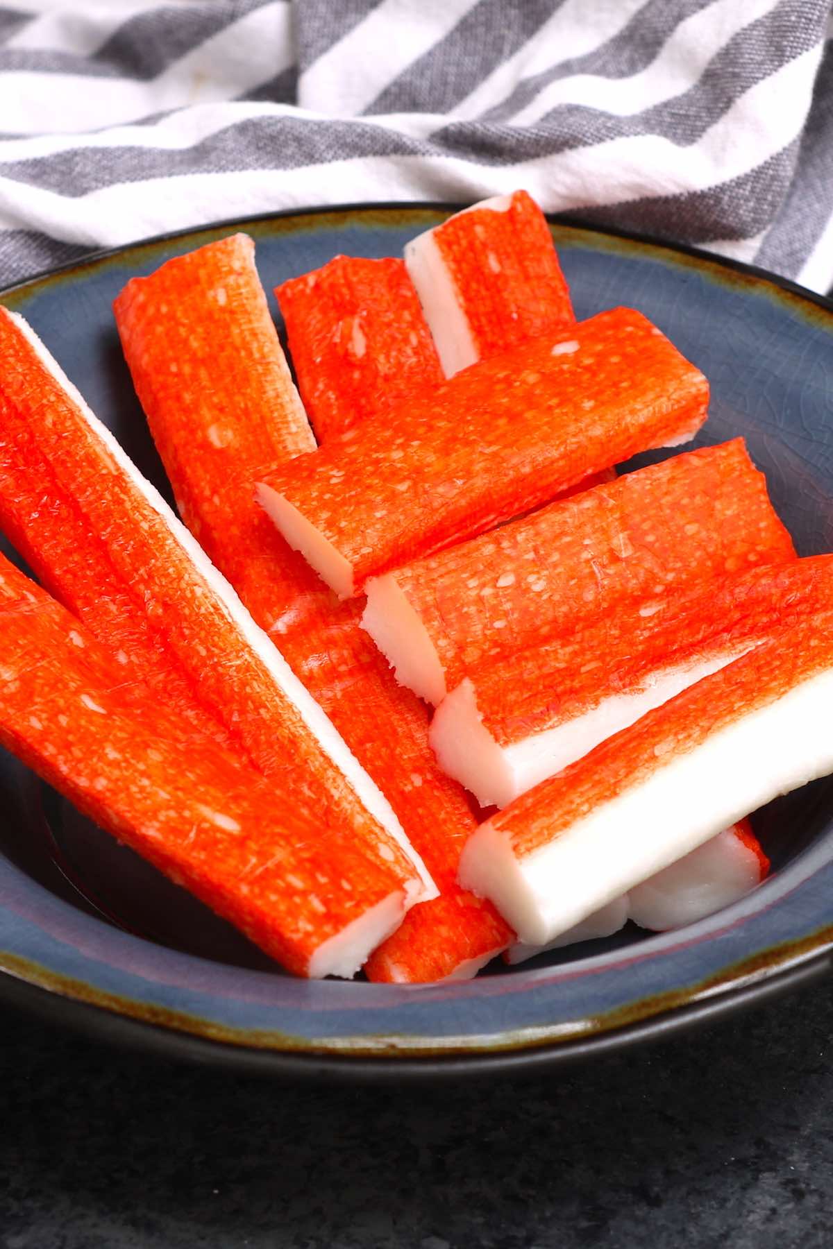 Kanikama is the Japanese name for imitation crab, which is processed fish meat, and sometimes called crab sticks or ocean sticks. It’s a popular ingredient commonly found in California Sushi Rolls, crab cakes, and crab rangoons. #Kanikama #ImitationCrab #ImitationCrabMeat #imitationCrabRecipes