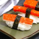 Kanikama Sushi Roll is made with imitation crab meat, sushi rice and nori seaweed sheet. It’s so easy to make and I’ll share with you how to make perfect kanikama nigiri sushi.
