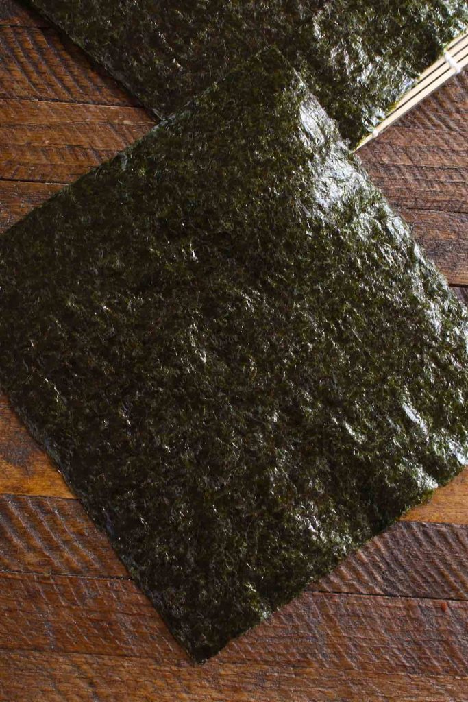 A piece of nori sheet on the counter.