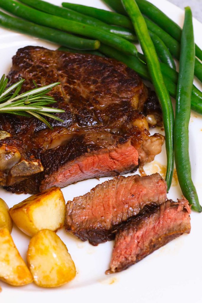 These Sous Vide Ribeye Steaks are cooked in a warm water bath to perfection and then butter-basted quickly in the skillet for a beautiful and flavorful brown crust. It’s so tender, juicy and really simple to make at home. It will remind you of those at your favorite steak house! #SousVideRibeye #SousVideRibeyeSteak