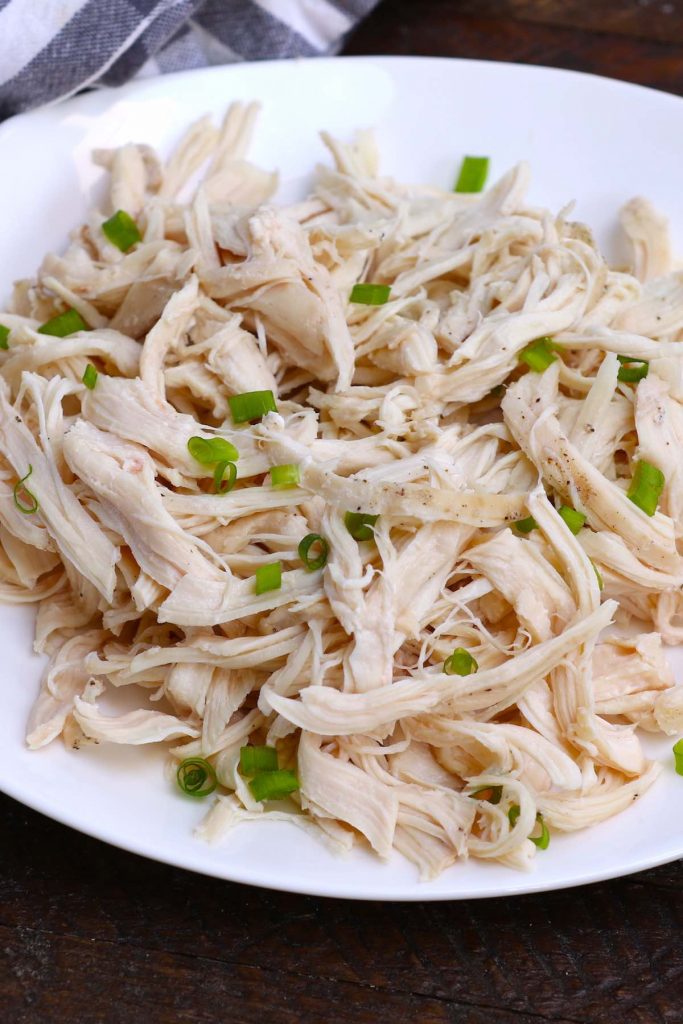 This Sous Vide Shredded Chicken is perfectly juicy and flavorful. The chicken breasts are sous vide cooked in a warm water bath at a precise temperature – the easiest way to cook sous vide chicken for shredding, from fresh or frozen! It’s incredibly versatile and is a healthy addition to tacos, sandwiches, soups and salads.  #SousVideShreddedChicken #SousVidePulledChicken #SousVideChickenTaco