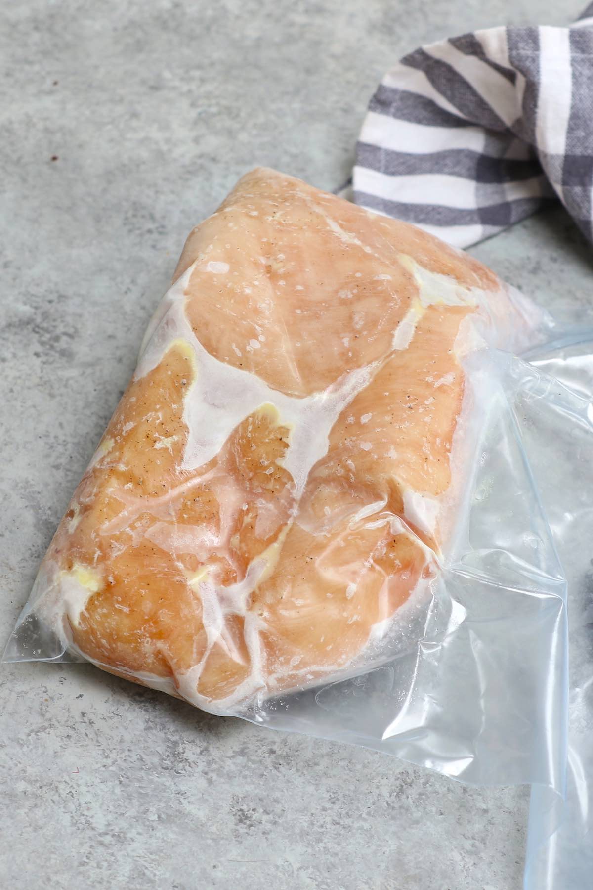 Sous Vide Frozen Chicken Breast is one of the best features of a sous vide machine. It’s easy, convenient, healthy and turn out so well EVERY TIME! I never take the time to thaw chicken again after I discovered this method. #SousVideChickenBreast #SousVideFrozenChickenBreast
