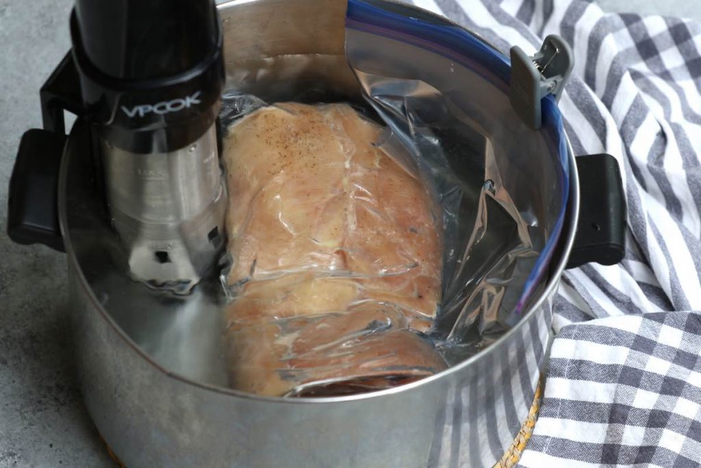 Cooking frozen chicken breasts in a sous vide water bath.