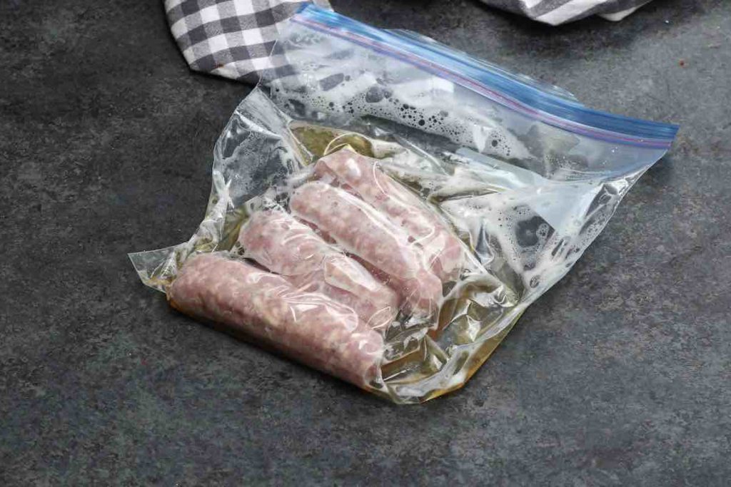 Sausages vacuum sealed in a ziploc bag.