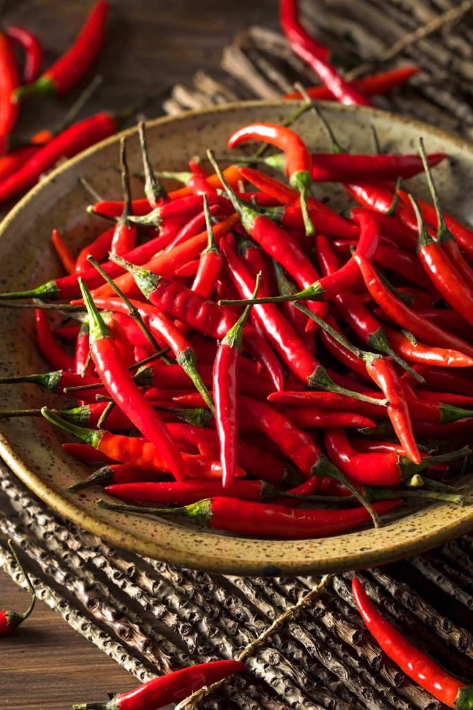 Thai peppers are spicy chili peppers that are used in many cuisines as a way to add heat to dishes. There are so many types of Thai chili peppers: some are mild; others are extremely hot. Let’s find out everything about Thai chili from types, heat level, usage, substitute, and more! #ThaiPepper #ThaiChili #ThaiChiliPepper