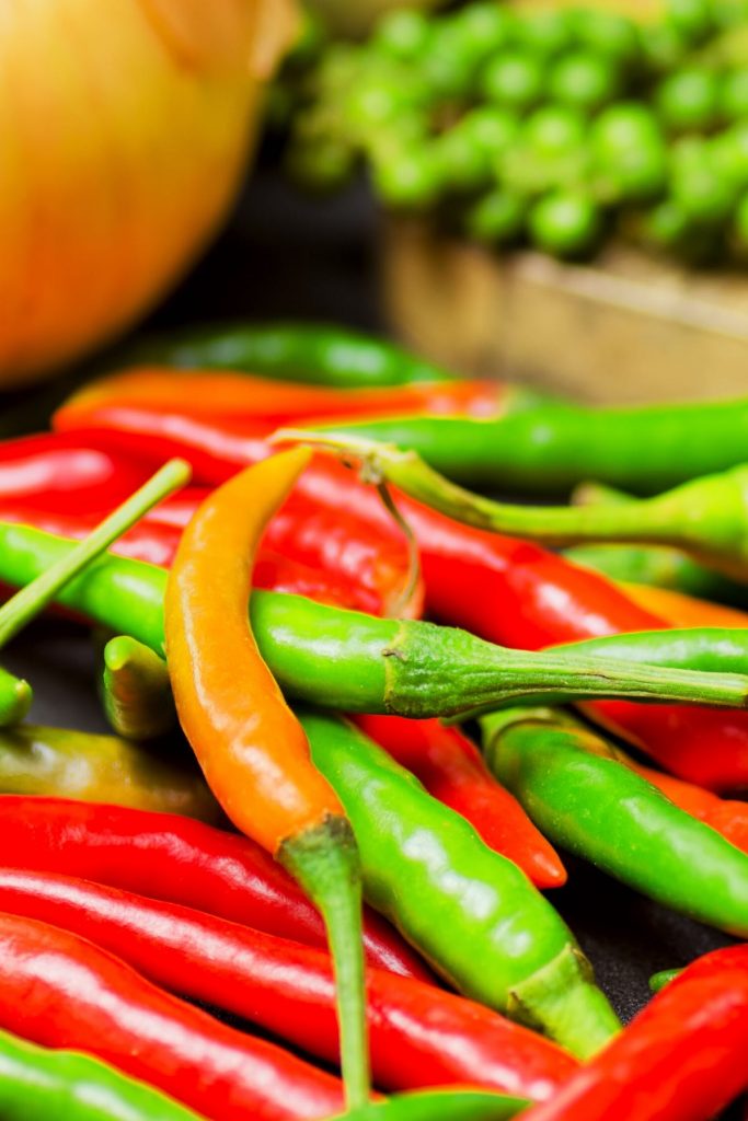 Thai peppers are spicy chili peppers that are used in many cuisines as a way to add heat to dishes. There are so many types of Thai chili peppers: some are mild; others are extremely hot. Learn how to use them, different types, heat levels, substitute, and more! #ThaiPepper #ThaiChili #ThaiChiliPepper