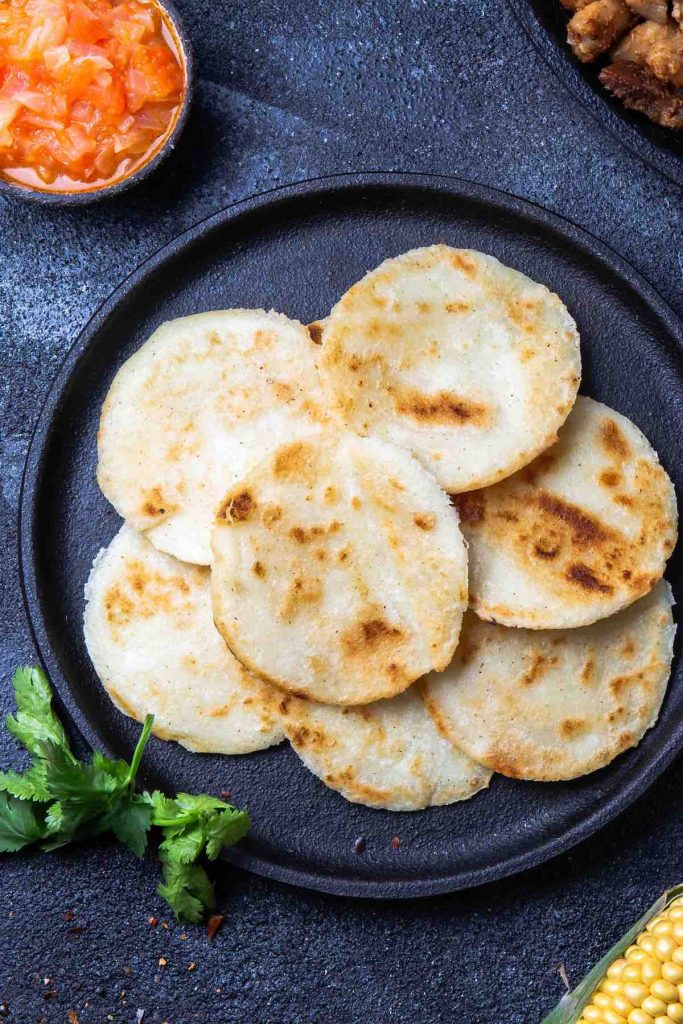 Homemade Arepa Paisa is so soft and fluffy – a delicious Colombian breakfast dish. It’s a popular flatbread made of corn, and can be served on its own or topped with eggs, cheese or meat!