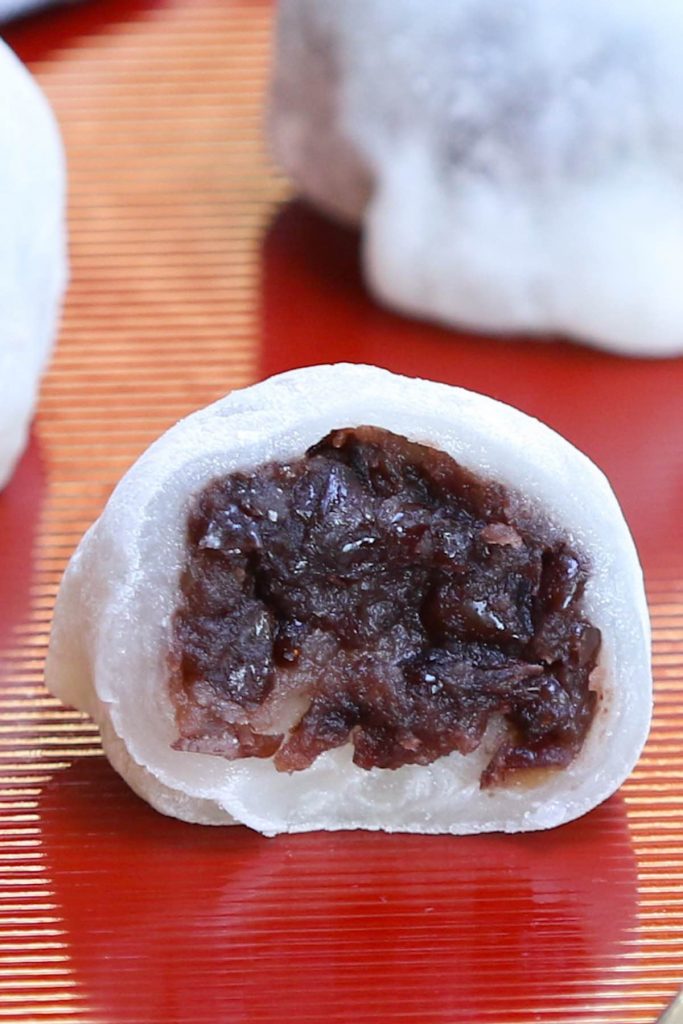 Daifuku!! This popular Japanese recipe makes a soft, tender, and chewy mochi rice cake enclosing a creamy, sweet red bean paste filling. Pure dessert bliss! With some simple tips, you can make this delicious snack in your own home and customize with your favorite fillings. #daifuku #DaifukuMochi