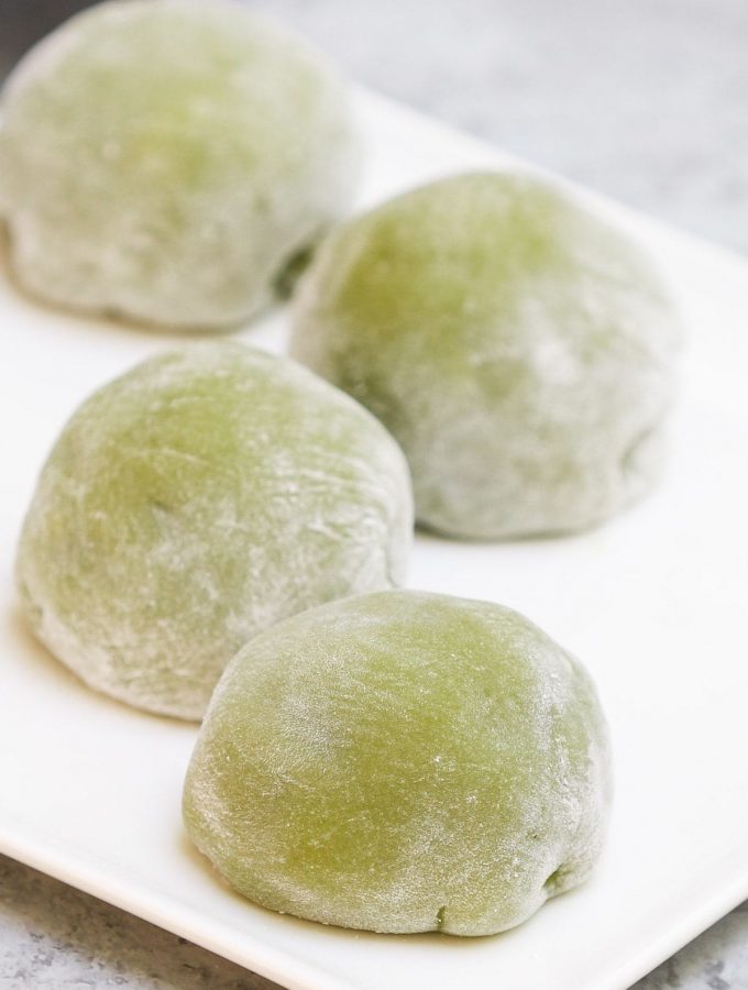 Homemade Green Tea Mochi is soft, chewy, and sweet with delicious matcha flavor and a beautiful green color. This classic Japanese treat is really easy to make at home and better than that from your favorite restaurant! Plus you can customize the filling with red bean paste, strawberry, or ice cream. #GreenTeaMochi #MatchaMochi