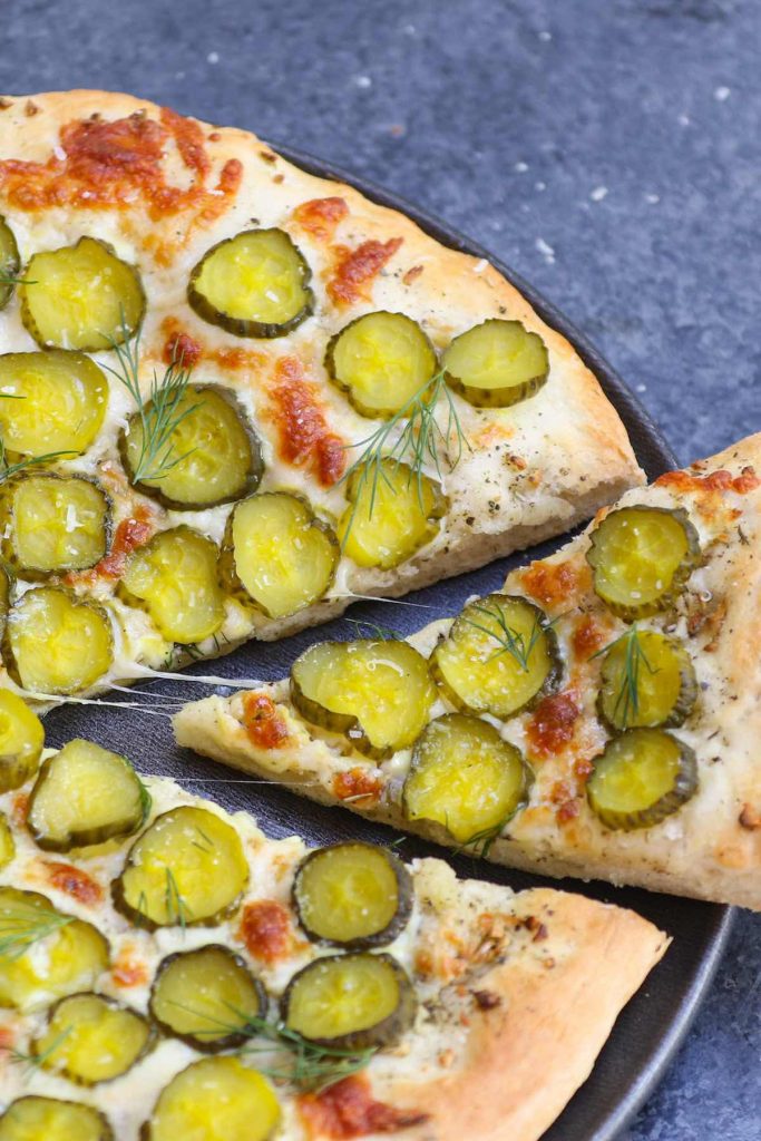 Pickles on Pizza! I never thought I’d like the idea, then once upon a time I tried Dill Pickle Pizza with garlic sauce. It changed my entire outlook on pickle pizza. The combination of cheesy, garlicky, and tangy flavors is seriously good! And there’s ranch on the side for dipping. #PicklePizza #DillPicklePizza