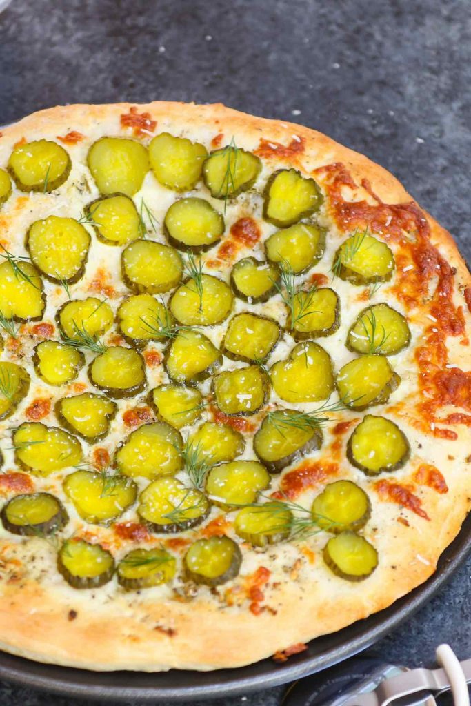 Pickles on Pizza! I never thought I’d like the idea, then once upon a time I tried Dill Pickle Pizza with garlic sauce. It changed my entire outlook on pickle pizza. The combination of cheesy, garlicky, and tangy flavors is seriously good! And there’s ranch on the side for dipping. #PicklePizza #DillPicklePizza