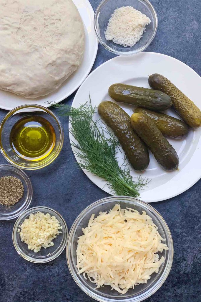 Dill pickle pizza ingredients on the counter.