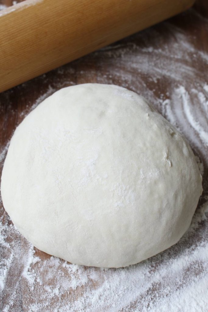 Homemade pizza dough on the counter.