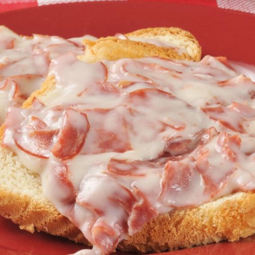 Shit On A Shingle is the ultimate comfort meal that’s fast and inexpensive. My mom used to make this for a quick breakfast, lunch or light dinner. Also called SOS, it’s a classic American military dish made with creamed, chipped beef, and served over toast. This is a healthier version with lighter creamy white sauce. #ShitOnAShingle #ChippedBeef #CreamedChippedBeef