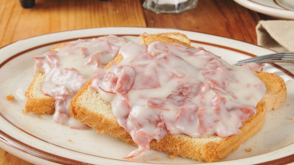Shit On A Shingle is the ultimate comfort meal that’s fast and inexpensive. My mom used to make this for a quick breakfast, lunch or light dinner. Also called SOS, it’s a classic American military dish made with creamed chipped beef, and served over toast. This is a healthier version with lighter creamy white sauce. #ShitOnAShingle #ChippedBeef #CreamedChippedBeef