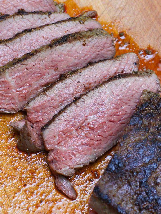Santa Maria Style Sous Vide Tri Tip nails the edge-to-edge perfection on this triangle shaped bottom sirloin cut, resulting in amazingly juicy and tender steak. The tri-tip roast is cooked low and slow in a sous vide water bath, and then seared quickly in the skillet for a peppery, garlic-y brown crust. #SousVideTriTip #TriTipSouVide